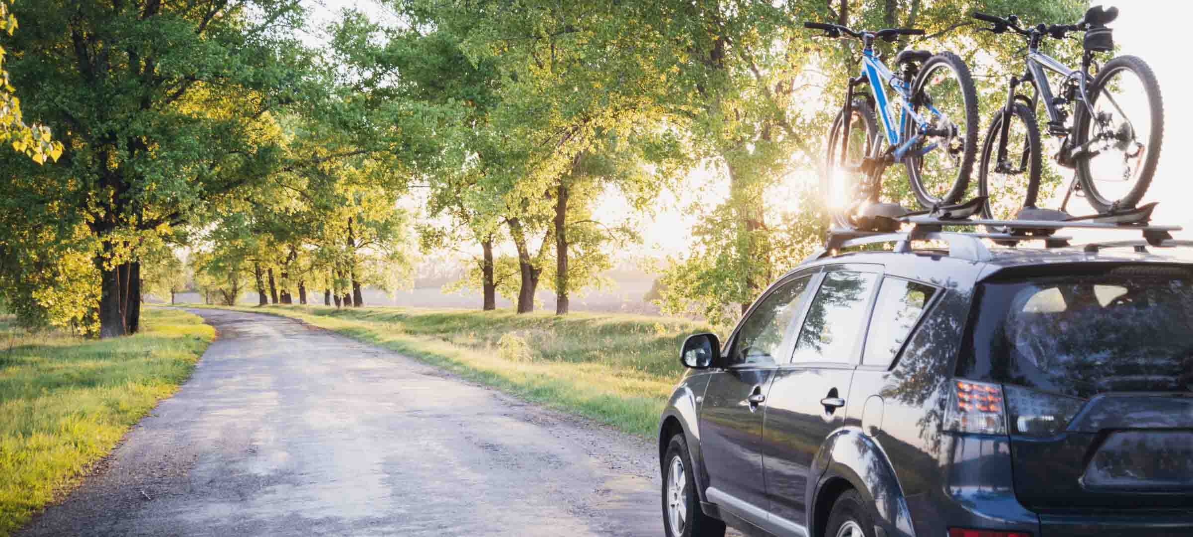 Spring Auto Banner 1 Car with bike on top load carrier